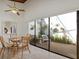 Sunlit breakfast nook with view into a private courtyard featuring lush greenery, seating, and tranquil ambiance at 2637 Sunburst Ct, Lake Wales, FL 33898