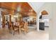 Dining room with wood floors, wood ceiling, a chandelier, and a mirrored wall; access to the kitchen nearby at 2637 Sunburst Ct, Lake Wales, FL 33898