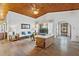 Bright and spacious living room with vaulted wood ceiling and tile floors at 2637 Sunburst Ct, Lake Wales, FL 33898