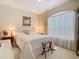 Bright bedroom with a large window, comfortable bed, and classic furniture at 2723 Rutledge Ct, Winter Haven, FL 33884