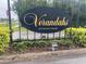 Verandahs: A Deed Restricted Community entrance sign with landscaping and black iron fence at 2723 Rutledge Ct, Winter Haven, FL 33884