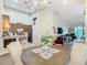 Open dining room with view of the modern kitchen and the living room at 2723 Rutledge Ct, Winter Haven, FL 33884