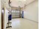 Well-organized garage with epoxy floor, storage shelves, and an automatic door at 2723 Rutledge Ct, Winter Haven, FL 33884