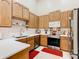 Well-lit kitchen with stainless steel appliances and white countertops at 2723 Rutledge Ct, Winter Haven, FL 33884