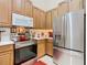 Modern kitchen with stainless steel appliances and ample counter space at 2723 Rutledge Ct, Winter Haven, FL 33884