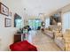 Bright and airy living room with neutral tones, wood floors, and access to the lanai at 2723 Rutledge Ct, Winter Haven, FL 33884