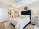Comfortable main bedroom showcasing a plush bed, stylish rug, and ensuite bathroom at 2723 Rutledge Ct, Winter Haven, FL 33884