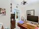 Home office with a desk, computer, shelving, and a view to an adjacent bathroom at 2723 Rutledge Ct, Winter Haven, FL 33884