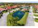 Aerial view of a water feature, pool, and homes inside a gorgeous residential community at 2725 Clubhouse Dr, Lake Wales, FL 33898