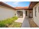 Private courtyard entrance with sliding glass doors and decorative rock landscaping at 2725 Clubhouse Dr, Lake Wales, FL 33898