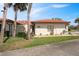 Charming single-story home with a tile roof, front lawn, and well-manicured landscaping at 2725 Clubhouse Dr, Lake Wales, FL 33898