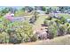 Aerial view of large property lot, outlined in red, with access to lake at 3065 E Central Ave, Bartow, FL 33830