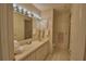 Well-maintained bathroom featuring a vanity with a large mirror and ample lighting, perfect for morning routines at 3065 E Central Ave, Bartow, FL 33830