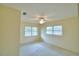 Well-lit bedroom featuring a ceiling fan and large windows, creating a relaxing and inviting atmosphere at 3065 E Central Ave, Bartow, FL 33830