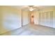 Bedroom featuring a ceiling fan, a window with blinds, and a closet with louvered doors at 3065 E Central Ave, Bartow, FL 33830