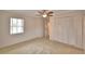 Bedroom featuring a ceiling fan, and double closet, illuminated by natural light from a window at 3065 E Central Ave, Bartow, FL 33830