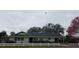 Charming single-story home with white picket fence and mature landscaping at 3065 E Central Ave, Bartow, FL 33830