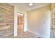 Inviting foyer with stone accent wall and neutral tile flooring that transitions seamlessly into the adjacent rooms at 3065 E Central Ave, Bartow, FL 33830