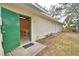 Detached two-car garage with side entry door and grassy surroundings at 3065 E Central Ave, Bartow, FL 33830