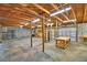 Spacious garage interior featuring wooden beams and shelving units at 3065 E Central Ave, Bartow, FL 33830