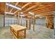 Open garage interior with exposed wood beams and shelving units at 3065 E Central Ave, Bartow, FL 33830