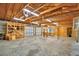 Spacious garage featuring exposed wood rafters, cinder block walls, and two garage doors at 3065 E Central Ave, Bartow, FL 33830