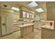 Well-lit kitchen with an island, light cabinets, and a ceramic tile backsplash at 3065 E Central Ave, Bartow, FL 33830