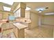 Bright kitchen featuring an island, ample counter space, and tile flooring at 3065 E Central Ave, Bartow, FL 33830