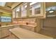 Spacious kitchen with an island, a tile backsplash, and an open doorway leading to the dining room at 3065 E Central Ave, Bartow, FL 33830