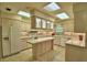 Kitchen features an island, tile flooring, and modern appliances at 3065 E Central Ave, Bartow, FL 33830