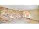 Large living room featuring a stone accent wall and neutral flooring at 3065 E Central Ave, Bartow, FL 33830