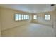 Bright and airy living room with large windows, and neutral carpet at 3065 E Central Ave, Bartow, FL 33830
