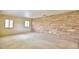 Spacious living room with a stone accent wall and natural light at 3065 E Central Ave, Bartow, FL 33830