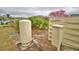 Well equipment with a water tank surrounded by various greenery at 3065 E Central Ave, Bartow, FL 33830
