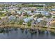 Aerial view of a neighborhood with a home marked by a green pin with lake view at 3416 Grenville Dr, Winter Haven, FL 33884