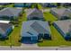 Aerial view of the home shows a driveway, garage, and a covered porch at 3686 Plymouth Dr, Winter Haven, FL 33884