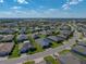Aerial view of the neighborhood shows the surrounding houses and green landscape at 3686 Plymouth Dr, Winter Haven, FL 33884