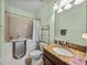Bathroom with walk-in tub, granite countertop, and medicine cabinet at 3686 Plymouth Dr, Winter Haven, FL 33884