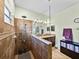 The bathroom has a tiled shower with a glass partition, double sinks, and wood-look floors at 3686 Plymouth Dr, Winter Haven, FL 33884