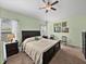 Cozy bedroom features a comfortable bed, soft lighting, and neutral decor at 3686 Plymouth Dr, Winter Haven, FL 33884
