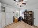 Bedroom featuring wood floors, built in shelving, and a ceiling fan at 3686 Plymouth Dr, Winter Haven, FL 33884
