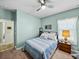 Bedroom featuring bright blue walls, neutral carpeting, and white trim at 3686 Plymouth Dr, Winter Haven, FL 33884