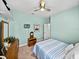 Bedroom featuring bright blue walls, neutral carpeting, and white trim at 3686 Plymouth Dr, Winter Haven, FL 33884