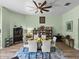 Dining area features a ceiling fan, seating for six, and views of the screened-in patio at 3686 Plymouth Dr, Winter Haven, FL 33884