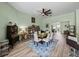 Bright dining area with a view into the living room and a modern table with six chairs at 3686 Plymouth Dr, Winter Haven, FL 33884