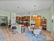 Bright kitchen with granite countertops, stainless appliances, breakfast bar, and adjacent dining area at 3686 Plymouth Dr, Winter Haven, FL 33884