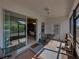 Screened-in lanai that leads to the house, complete with outdoor furniture and view of the kitchen at 3686 Plymouth Dr, Winter Haven, FL 33884