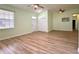 Bright living room showcasing wood floors, recessed lighting, and closet storage at 3686 Plymouth Dr, Winter Haven, FL 33884