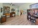 Bright living area with hard flooring, built-in shelving, and a view into the kitchen at 3686 Plymouth Dr, Winter Haven, FL 33884