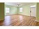 Open living room with wood floors, plenty of natural light, and a welcoming atmosphere at 3686 Plymouth Dr, Winter Haven, FL 33884